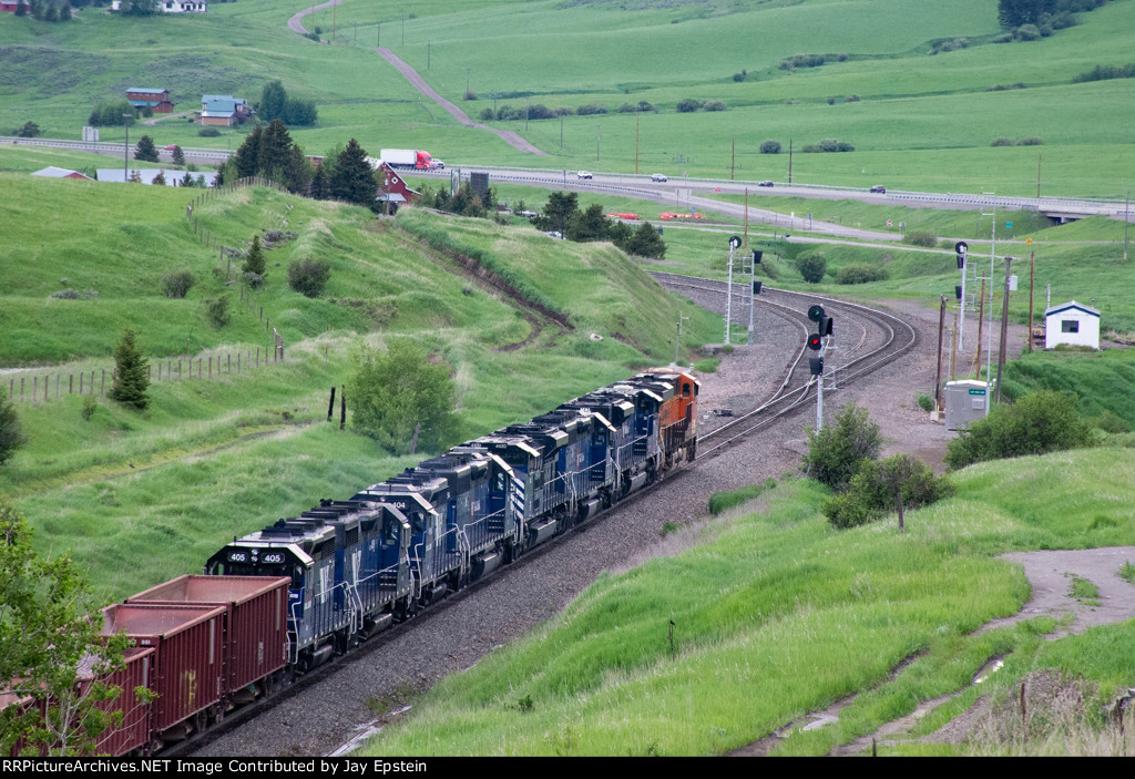 A westbound ballast train approaches West End Siding 